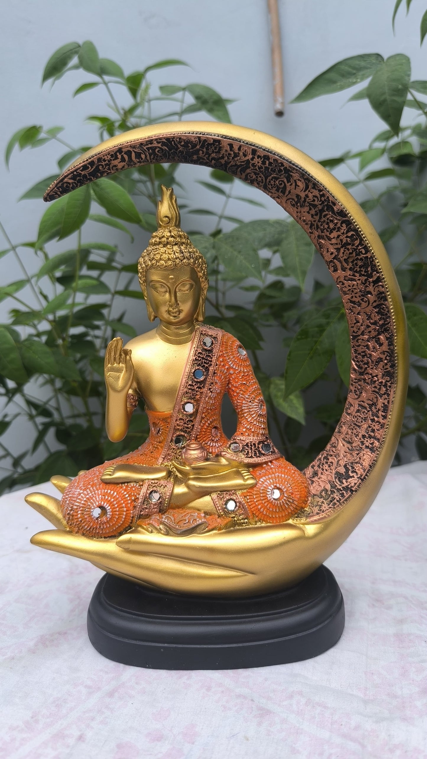 11 Inch Resin Buddha Idol in Hand Cradle with Moon Arc | Orange & Golden Decorative Buddha Statue for Home, Mandir & Gift"