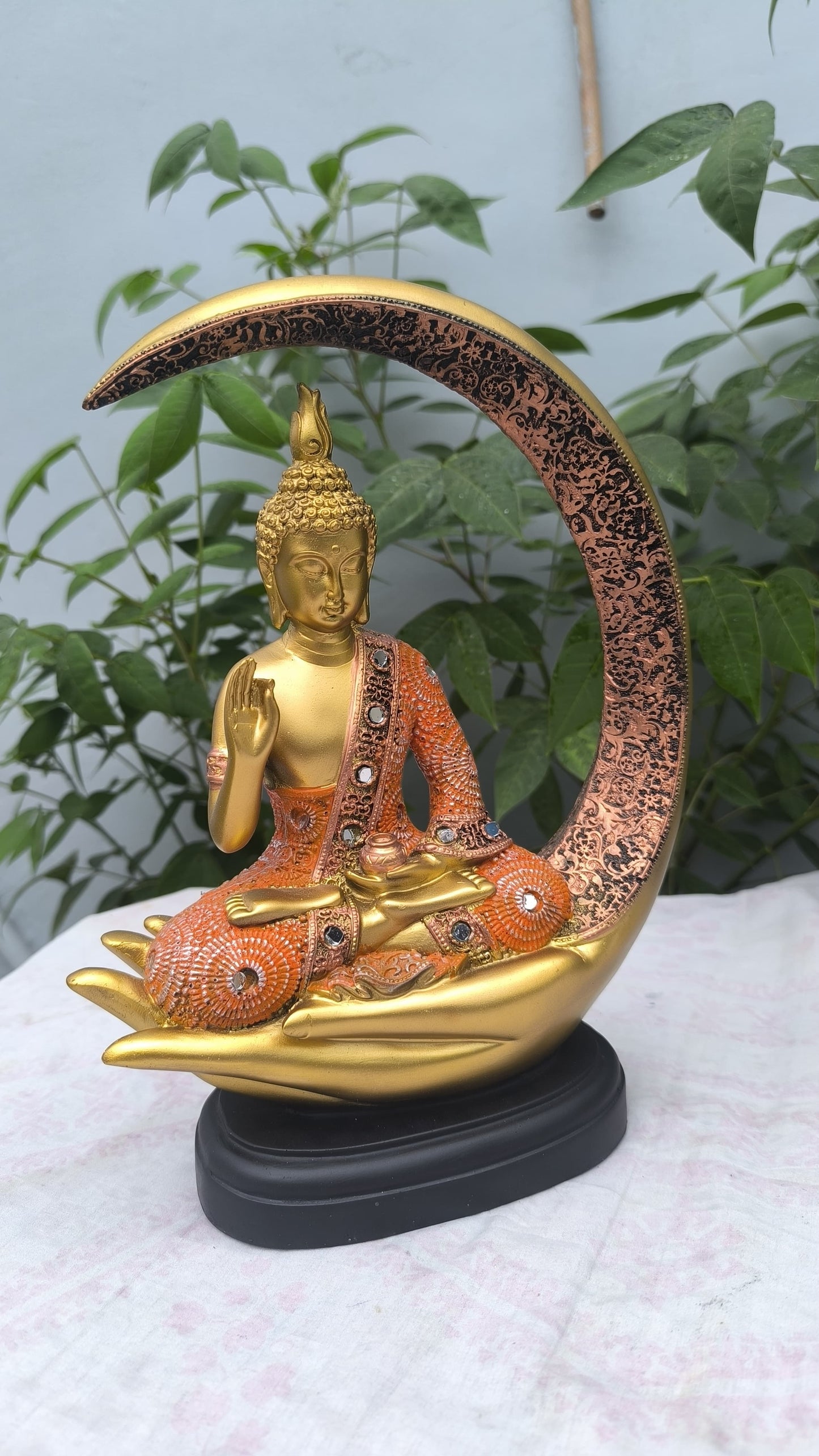 11 Inch Resin Buddha Idol in Hand Cradle with Moon Arc | Orange & Golden Decorative Buddha Statue for Home, Mandir & Gift"