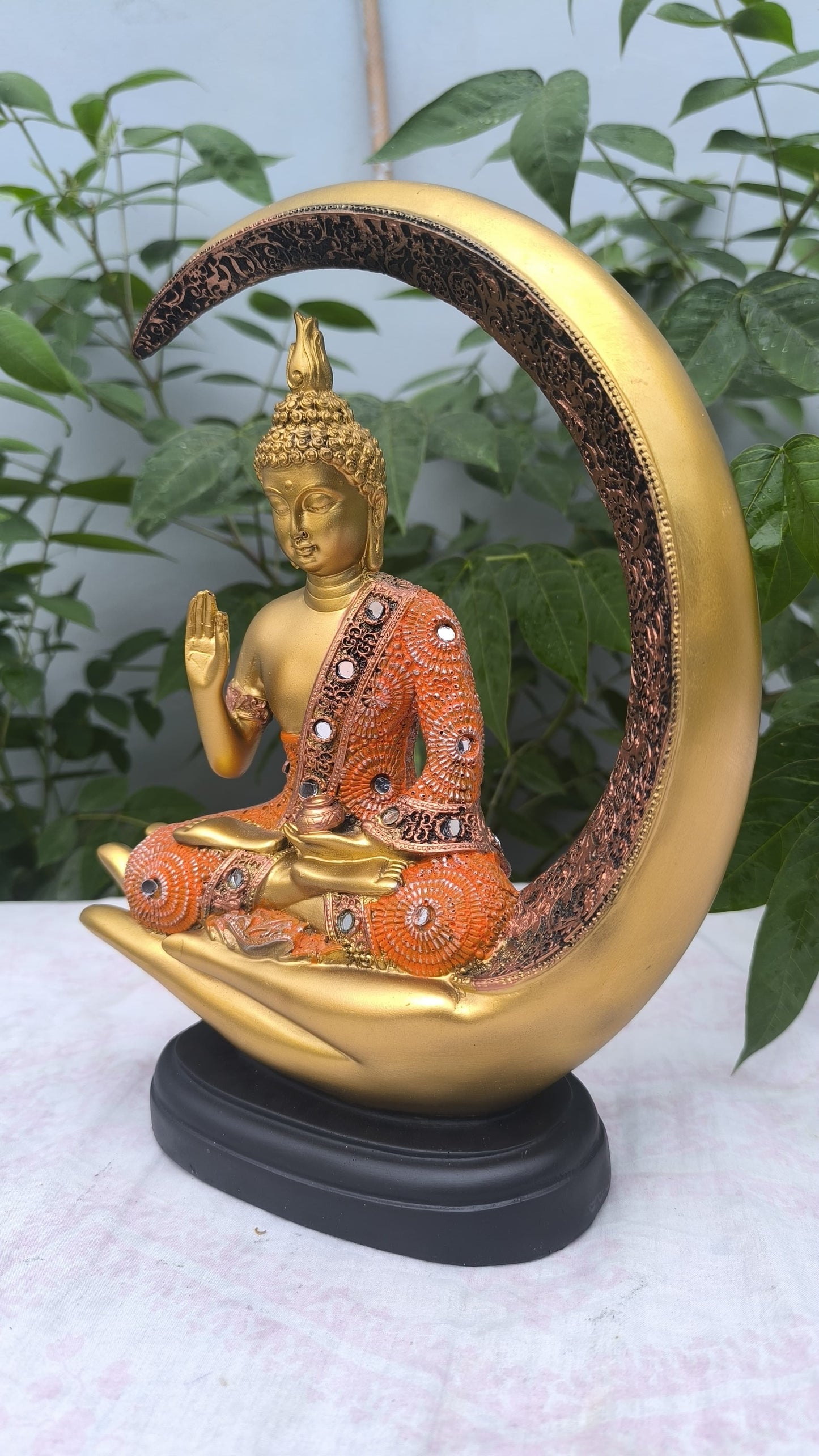 11 Inch Resin Buddha Idol in Hand Cradle with Moon Arc | Orange & Golden Decorative Buddha Statue for Home, Mandir & Gift"